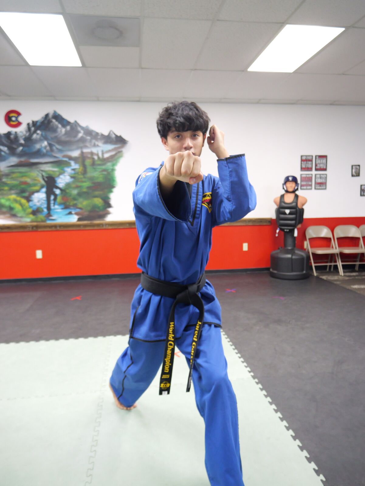 Teenage black belt student practicing a form at National Karate